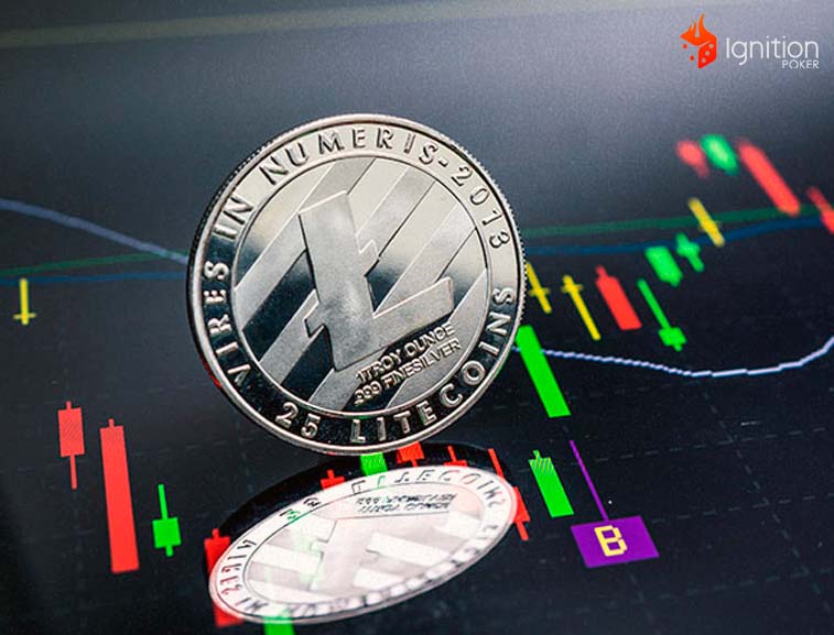 moneda cripto litecoin Moneda plata de Litecoin sobre un gráfico de datos